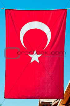 Turkish flag hanging vertically.