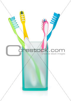 Four multicolored toothbrushes