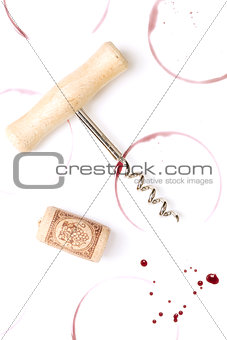 Wine stains, corkscrew and cork