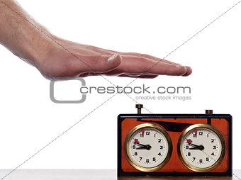 human hand over a chess clock timer