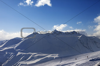 View on ski slope and beautiful mountains in evening