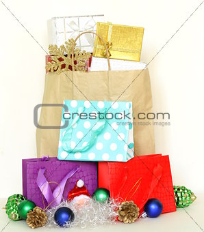 many gift boxes and colorful shopping bags on white background