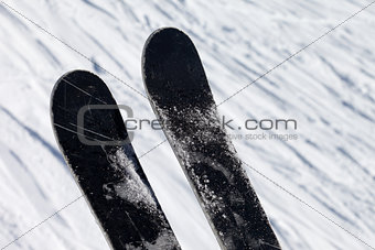 Skis over off-piste slope