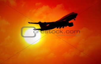 jet flying in sunset