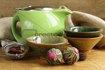 set for a traditional tea drinking (kettle, cups and green tea)