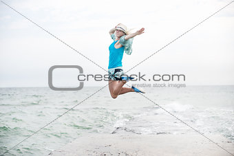 Young Girl Jumping at Beach