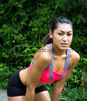 Young woman resting after running