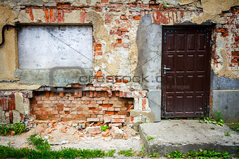 Boarded up window and old door