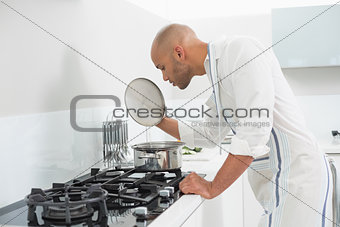 Young man preparing food in the kitchen