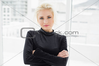Beautiful casual woman in black with hands folded
