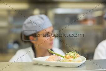 Salmon dinner on a plate on order station