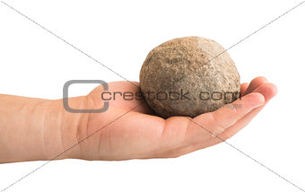 Hand holding stone ball