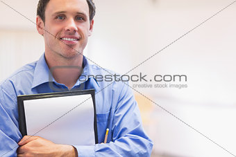 Close up portrait of an elegant male teacher with notepad