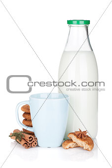 Cup, bottle of milk and cookies