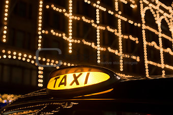Taxi in London in front of a shopping center
