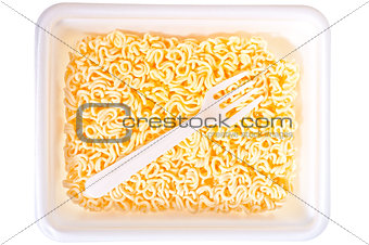 Chinese dry noodles and fork close-up