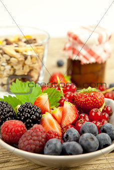 fresh tasty berry collection on table in summer