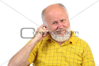 bald senior man picking his ear