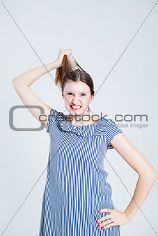 Attractive woman pulling her hair