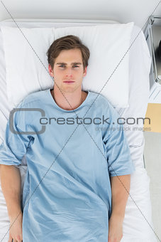Handsome patient lying in bed