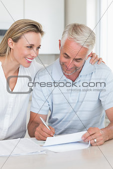 Happy couple working out their finances