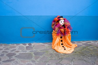 Orange clown - blue wall
