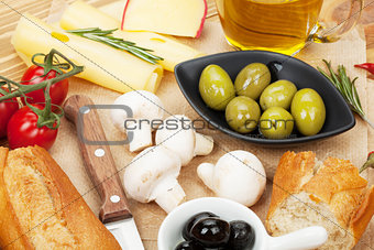 Olives, mushrooms, bread, vegetables and spices