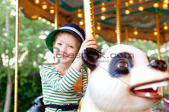 kid at the merry-go-round