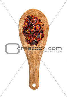 wooden spoon with seasonings on a white background