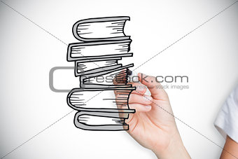 Composite image of businesswoman drawing books