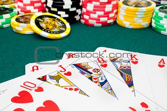 poker, royal flush and unfocused gambling chips