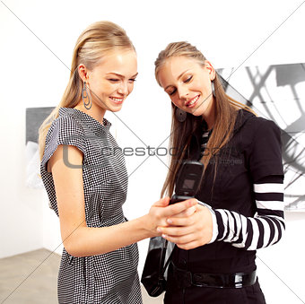 happy women with mobile phones