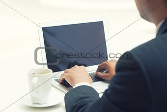 Indian businessman using laptop 