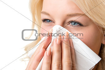 Ill woman with tissue is sneezing