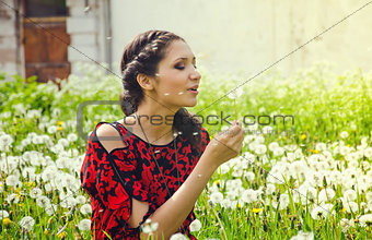 Woman Blowing Dandelion