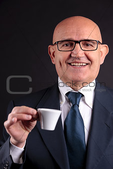old businessman with a cup of coffee