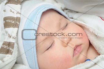 Newborn baby sleeping in clothes
