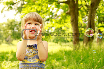 little girl with soap bubbles 