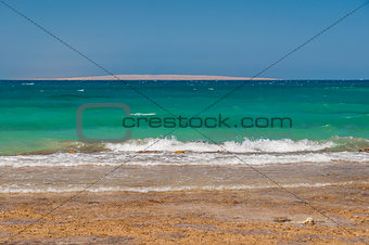 Beautiful azure red sea with waves and rocks in Egypt