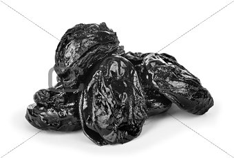Close up of pitted prunes isolated on white background