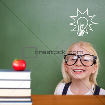 Composite image of cute pupil smiling