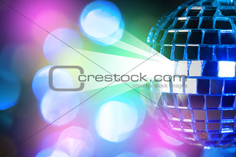 Blue shiny disco ball on Colorful bokeh background 