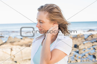 Casual woman standing by the sea
