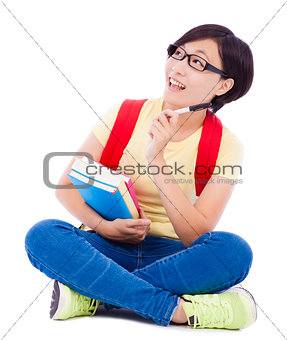 asian young student girl sitting on floor  with book