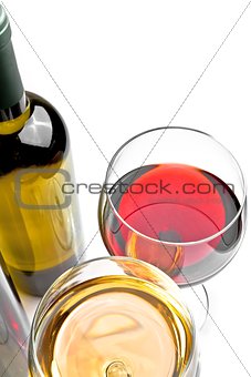 top of view of red and white wine glasses near wine bottle