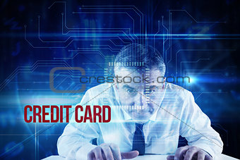 Credit card against blue technology interface with circuit board