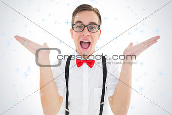 Composite image of geeky young hipster smiling at camera