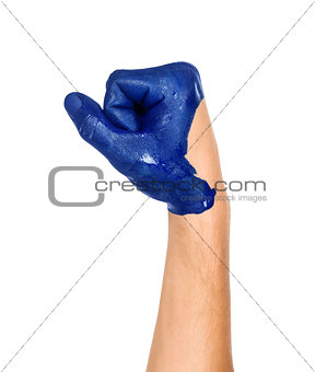 hand is clenched into a fist painted in blue on an isolated whit