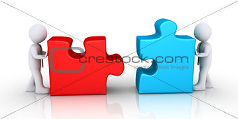 Businessmen about to connect puzzle pieces