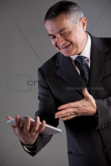 Senoir man using successfully a tablet